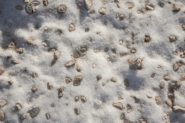 Stones and grass under the snow — Stock Photo, Image