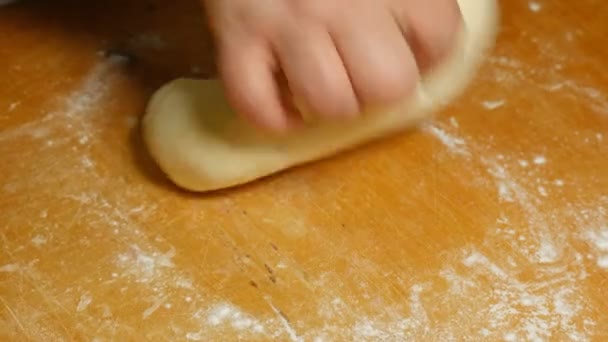 Baker kneading dough with hand on table in flour — Stock Video