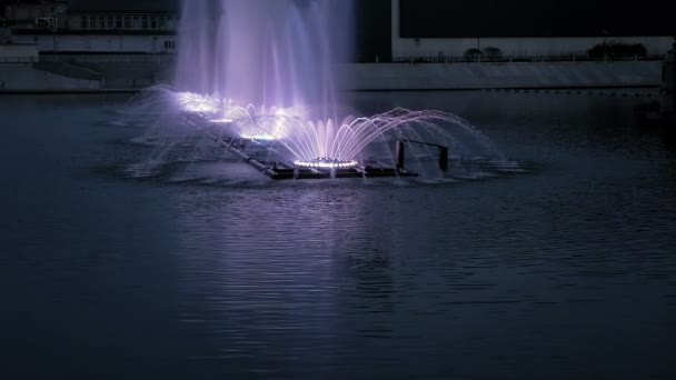 Bright fountain on the water pond or river — Stock Video