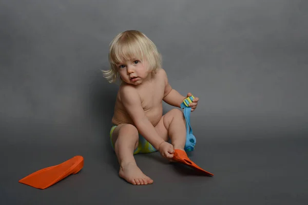 Little Boy Swimming Trunks Getting Ready Pool Putting Fins Royalty Free Stock Photos