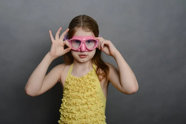 Little Girl Yellow Swimsuit Pink Mask Stock Image