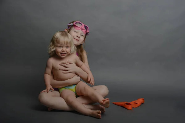 Big Sister Young Brother Swimwear Getting Ready Beach Holiday Stock Photo