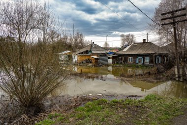 the village plot with the house was flooded due to the spring flood of the river.