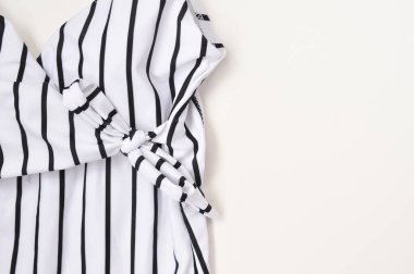 striped sweamwear on white background summer clothes for woman copy space