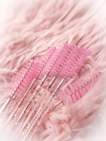 Pink brushes for lashes and brows and lash extensions