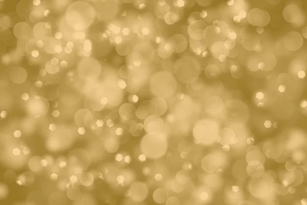 Golden shiny christmas bokeh on blurred background — Stock Photo, Image
