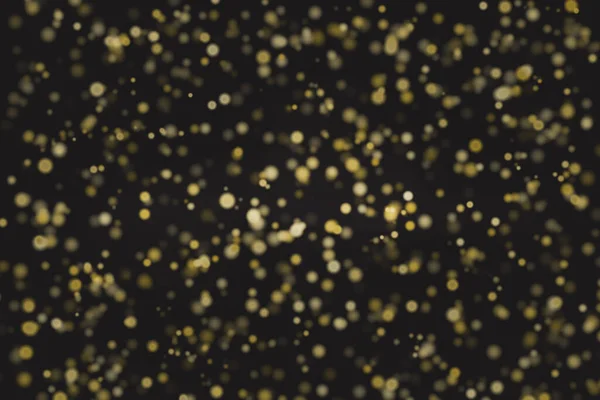 Złoty błyszczący bożonarodzeniowy bokeh na rozmytym tle — Zdjęcie stockowe