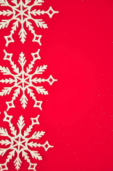 White snowflakes on red background copy space — Stock Photo, Image