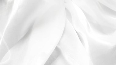 Yumuşak beyaz tül kumaş arka plan zarif görseller için havadar hafif bir doku oluşturur.