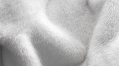 Beyaz kürk kumaş arka planı kış konforu ve yumuşaklığını iletiyor