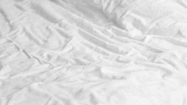 Close-up of a wrinkled white fabric surface suitable for various design projects