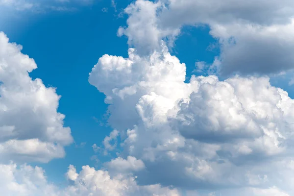 big clouds in the blue sky. Blue sky with heavy clouds background or texture