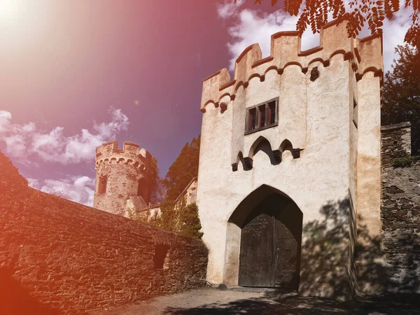 sunlit entrance to a medieval castle