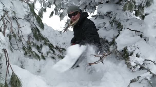 Young man shoveling snow — Stock Video