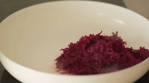 Cut beetroot in pan for cooking. — Stock Video