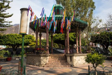 Ajijic, Jalisco, Mexico - January 15, 2021: Kiosk in the town square of Ajijic decorated with colorful ribbons. clipart