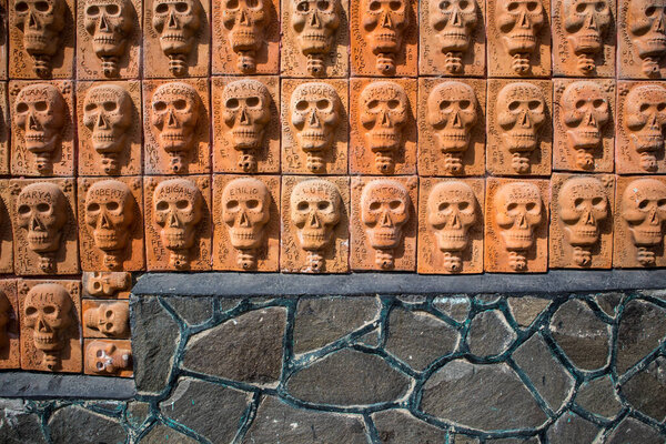 Ajijic, Jalisco, Mexico - January 15, 2021: Building with walls covered in clay skulls in Ajijic, Mexico.