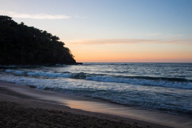 Beach sunset over the Pacific Ocean in Lo de Marcos, Riviera Nayarit, Mexico clipart