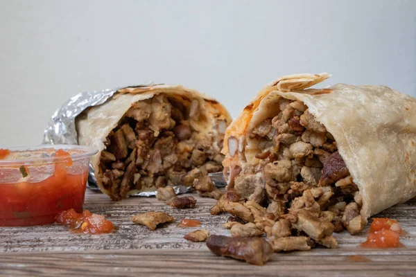 Close Carne Asada Beef Burrito Wrapped Foil Cut Half Has — Stock Photo, Image