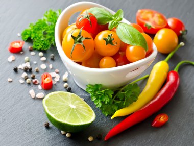 Ingredients for cooking with cherry tomatoes, herbs, chilis, lim clipart