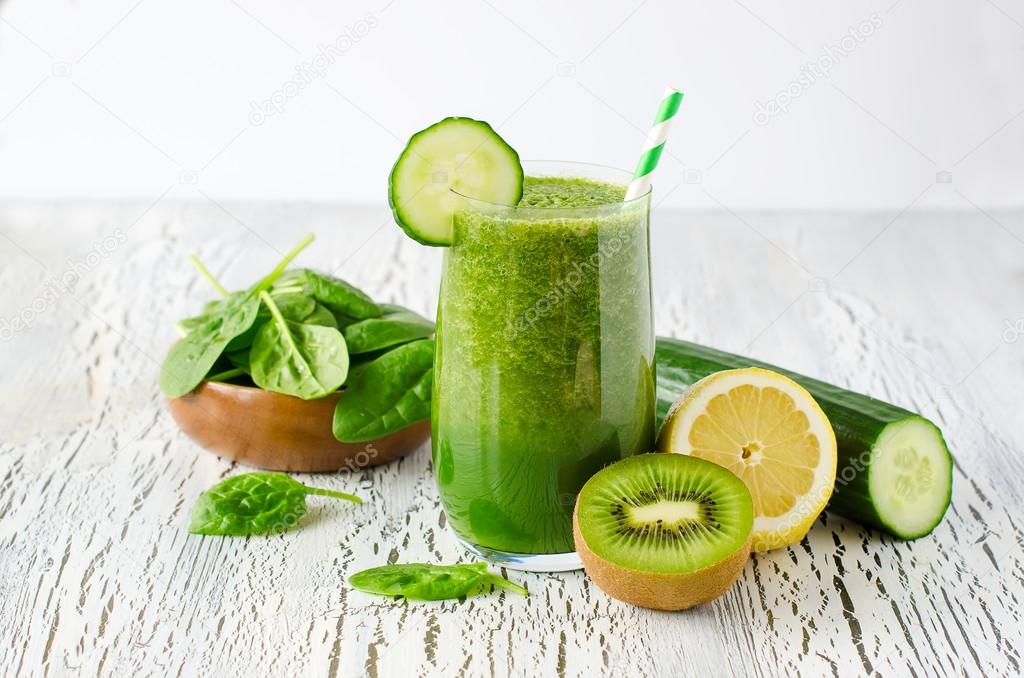 Green fresh healthy detox smoothie with spinach, cucmber, kiwi. 