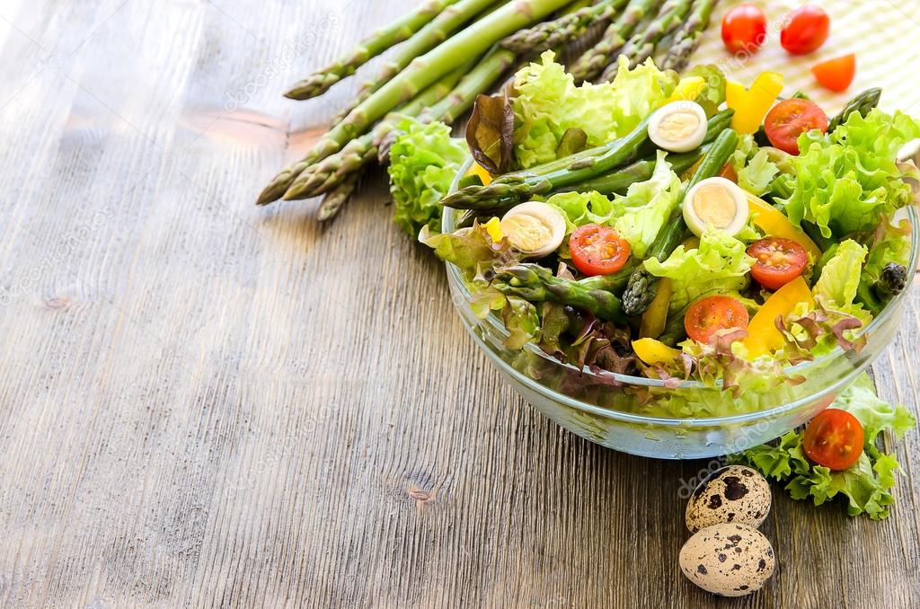 Fresh mix salad with green asparagus and eggs for healthy snack