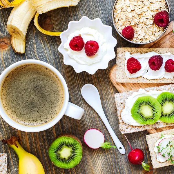 Healthy breakfast with crispbread, berries, yogurt and cress, sq