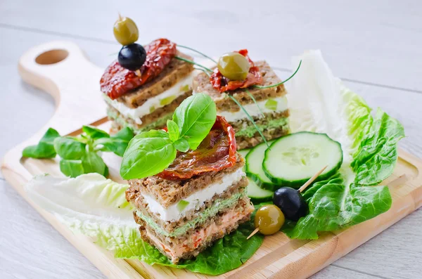 Rye granary bread sandwich with curd and antipasto — Stock Fotó