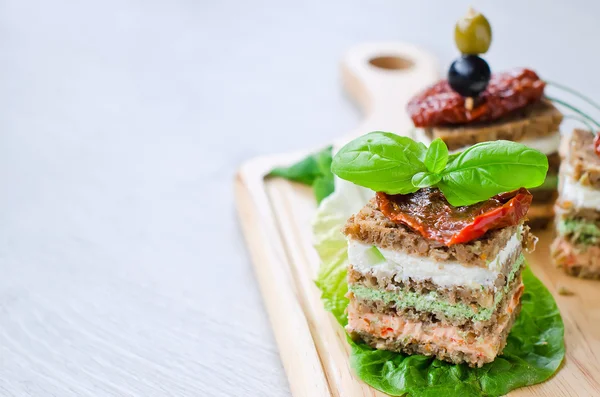 Rye granary bread sandwich cake with curd and antipasto copy spa — Stock Fotó