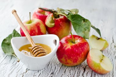 Fresh red apples with honey clipart