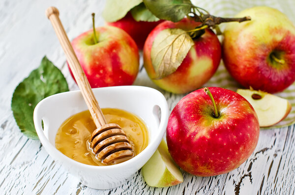 Fresh red apples with honey