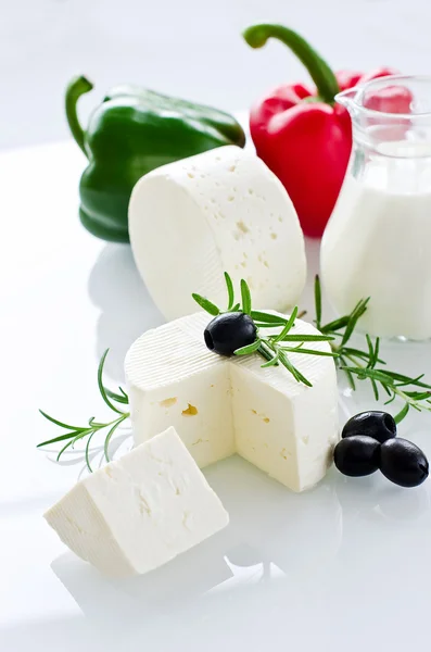 White paneer cheese with rosemary and black olives — Stock Photo, Image