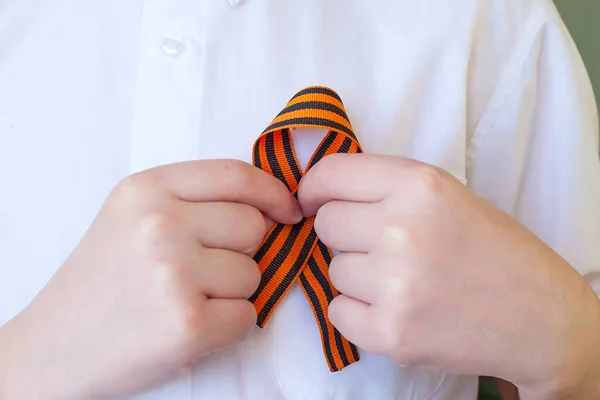 Orange Black Striped Ribbon Symbol May Hands Isolated White Background — Stock Photo, Image