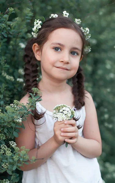 Little Gardener Girl Bushes White Flowers Child Takes Care Plants Fotos de stock