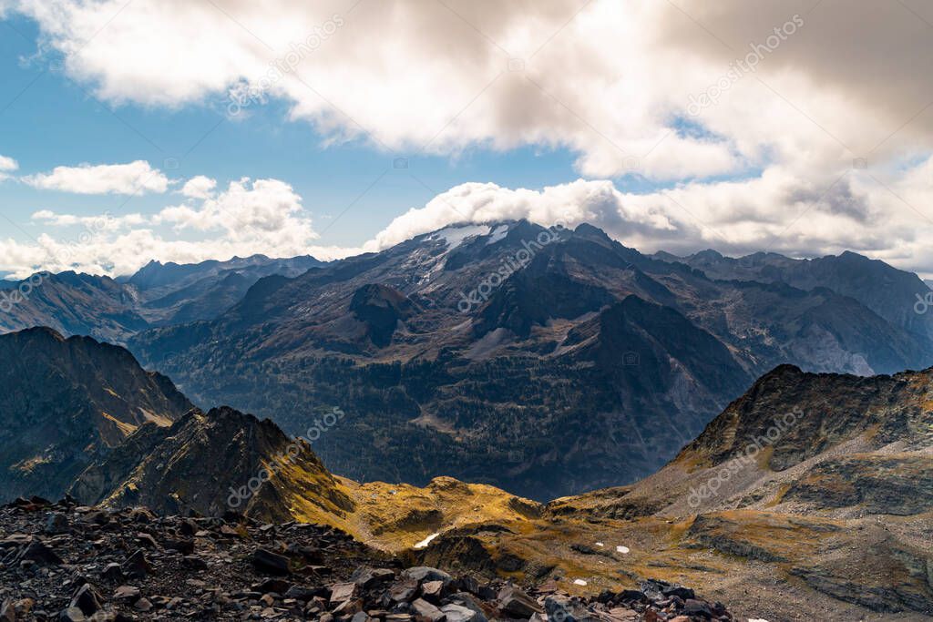 Views of the Maladetas massif with the Aneto and Maladeta peaks and Aneto glacier with some cloud coming down from the Sacroux peak in the Aragonese Pyrenees