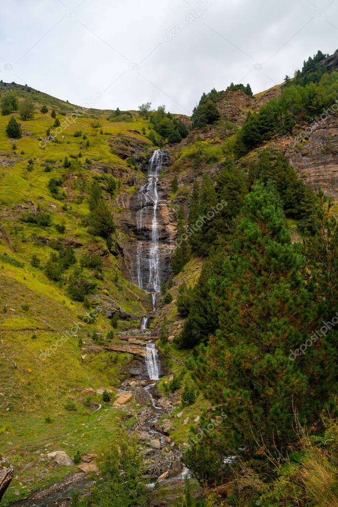 View of the first waterfall on the route of the Three waterfalls in Cerler in the Benasque valley in the Aragonese Pyrenees