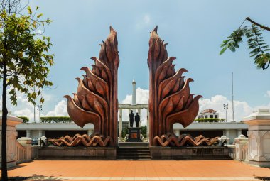 Typical gate entrance to the Museum Tugu Pahlawan in Surabaya, East Java, Indonesia clipart
