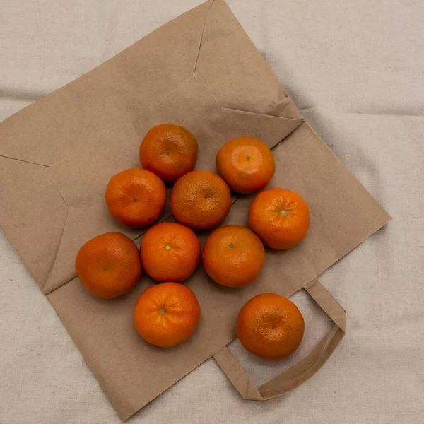 Several Brightly Colored Tangerines Arranged Eco Friendly Paper Bag Background — Stock Photo, Image