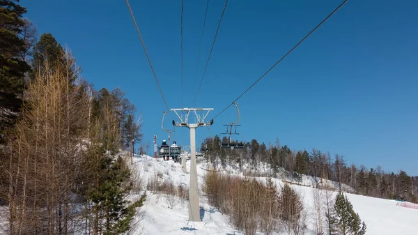 Chairlift Snow Covered Mountainside Blue Sky Forest Coniferous Bare Deciduous — Stock Photo, Image
