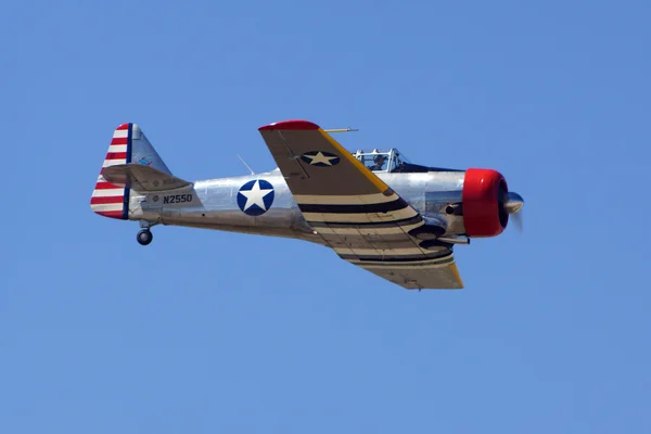 Airplane T-6 Texan trainer flying at 2016 March Air Show — Stock Photo, Image