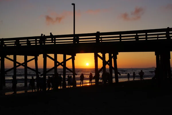 Playa muelle puesta de sol —  Fotos de Stock