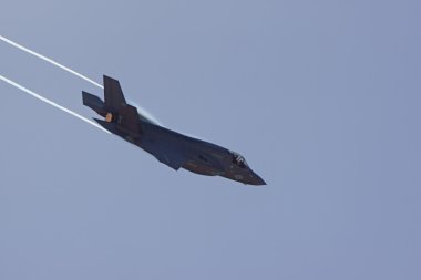 Airplane Stealth F-35 Lightning jet fighter flying at the 2015 Miramar Air Show in San Diego, California clipart
