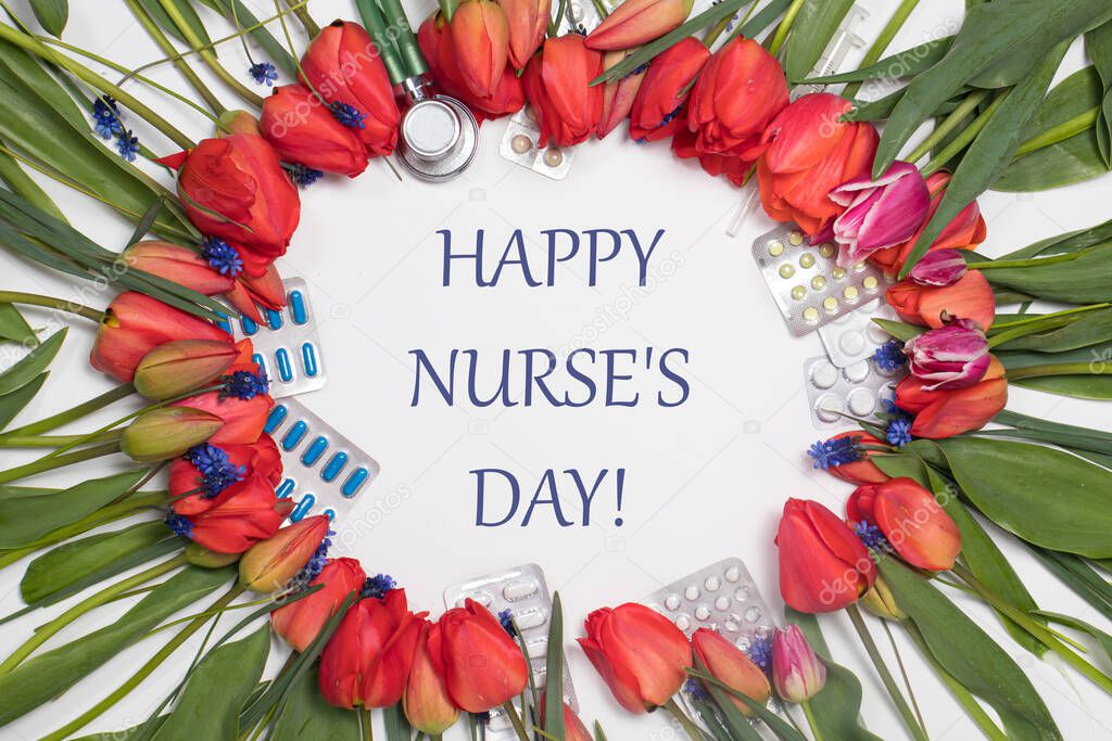 Flowers, phonendoscope and tablets - a banner with inscription Happy Nurse's Day on white