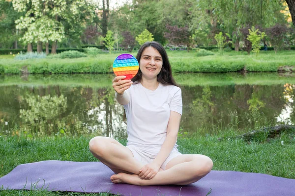 Woman Meditates Nature Eats Reusable Bubble Wrap Pop Antistress Toy — Stock Photo, Image