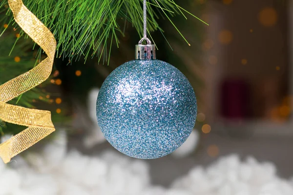 New Years card with a blue ball and a ribbon on a spruce branch. Happy New Year and Merry Christmas — Stock Photo, Image