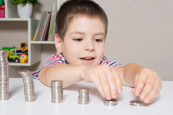 Child and coins - financial literacy for children, learning to spend money