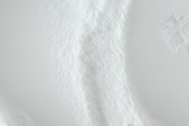 Kabartma tozu tozunun soyut beyaz arka planı.