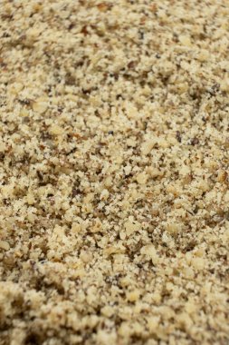 Zemin ceviz çekirdeklerinin ayrıntılı doku arkaplanı.