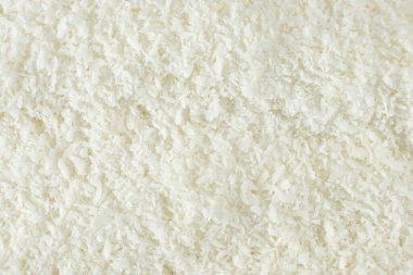 Beyaz kurutulmuş hindistan cevizi arkaplan dokusu üst görünümü.