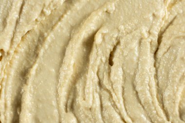 Yumuşak kremalı humus üst görünümünün makro dokusu.